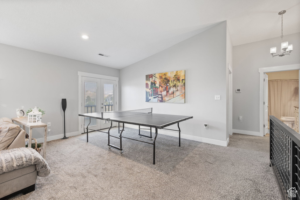 Game room featuring carpet flooring, lofted ceiling, a chandelier, baseboards, and recessed lighting