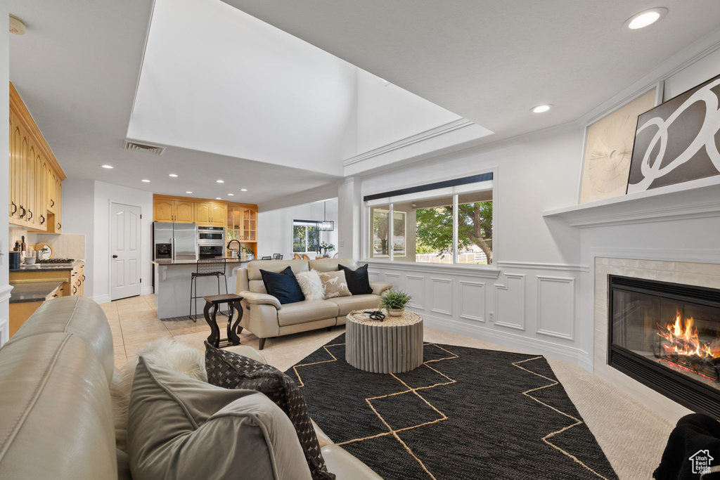 Living room featuring recessed lighting and a tile fireplace