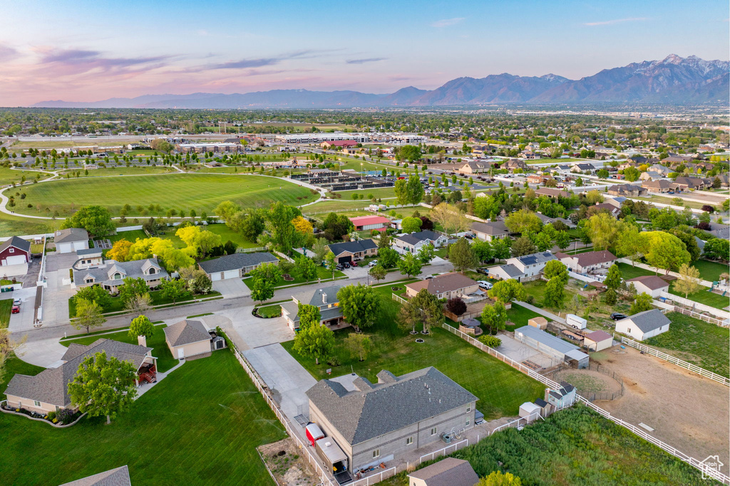 View of property location featuring mountains and nearby suburban area