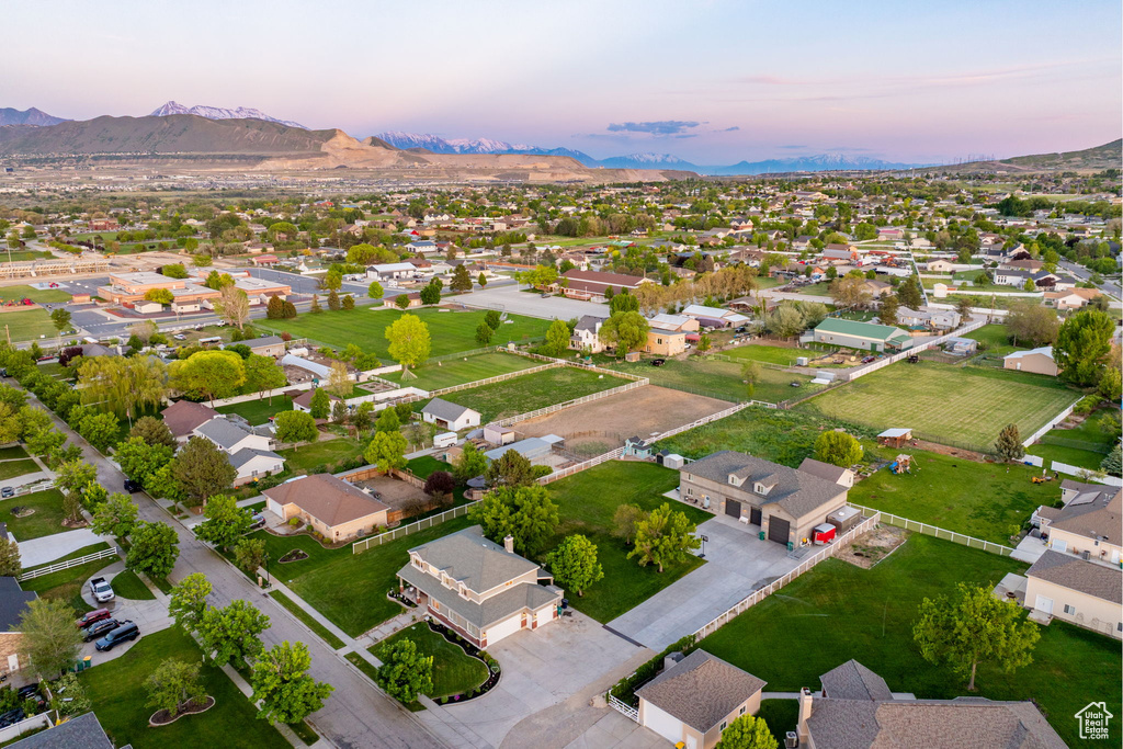 View of property location featuring a mountainous background and nearby suburban area