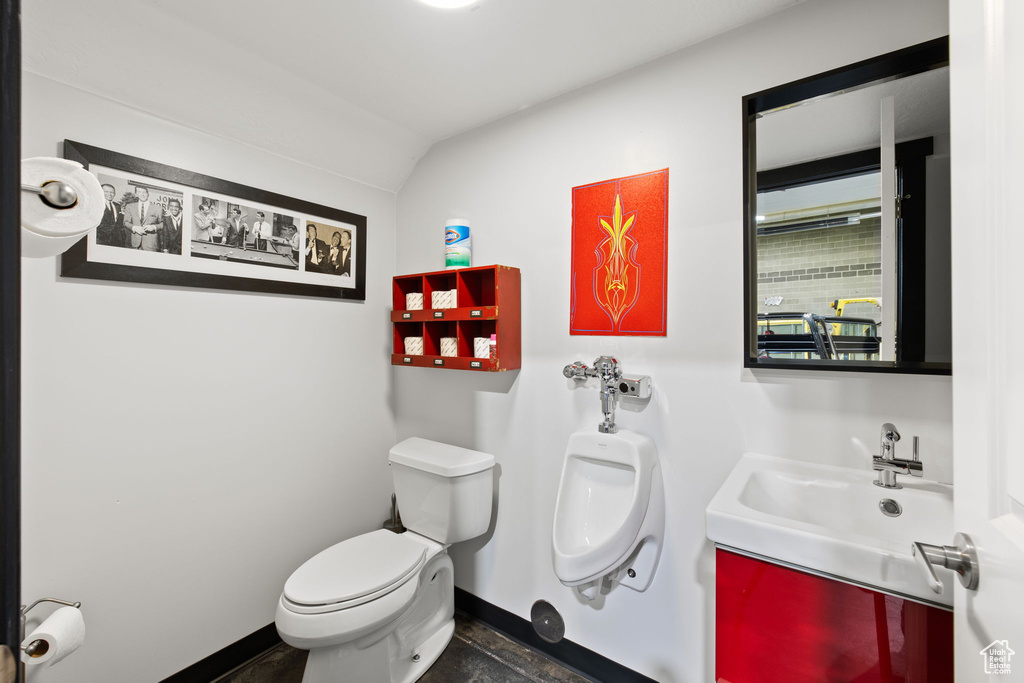 Bathroom with toilet and baseboards