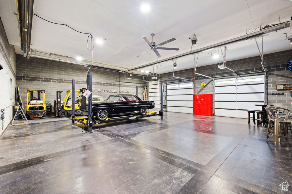 Garage featuring a ceiling fan and a garage door opener