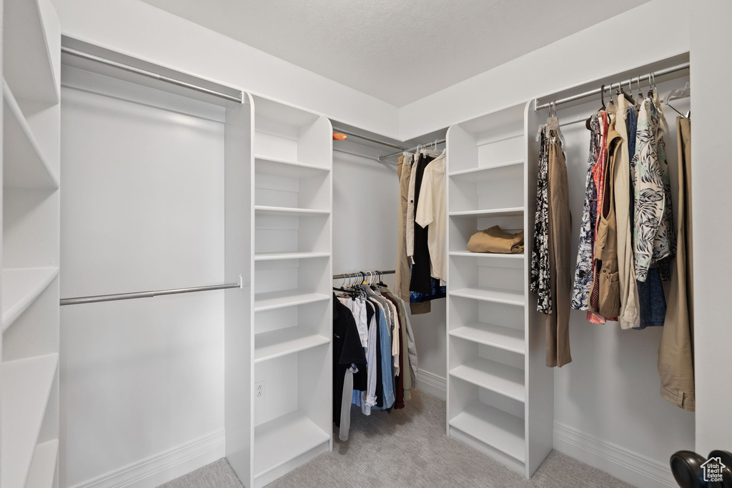 Spacious closet with carpet floors