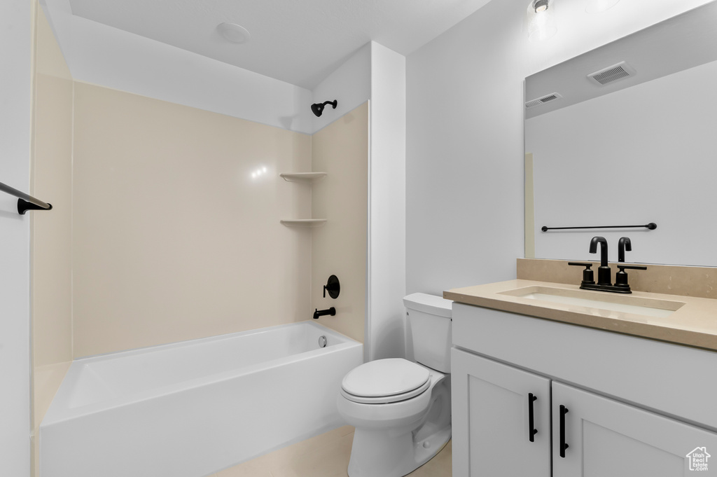 Full bathroom with  shower combination, toilet, and vanity