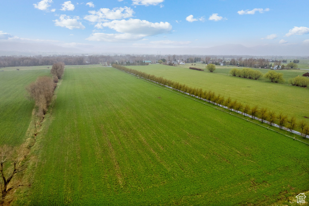 Birds eye view of property with a rural view and a mountain view
