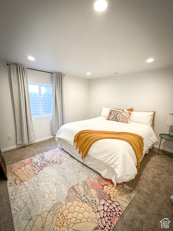Carpeted bedroom featuring recessed lighting and baseboards