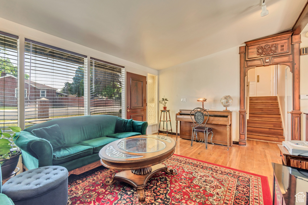 Living area featuring light wood-style flooring and stairway
