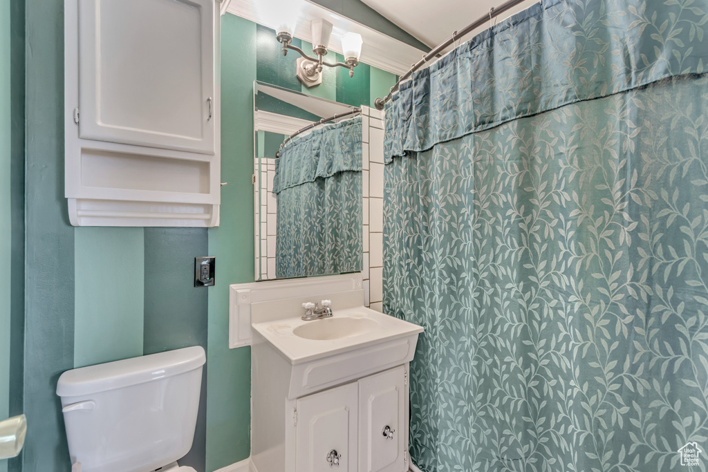 Bathroom featuring toilet and vanity