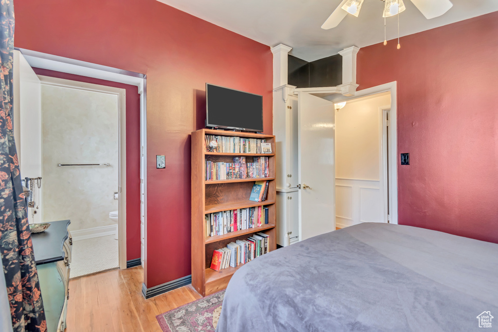 Bedroom with wood finished floors and a ceiling fan