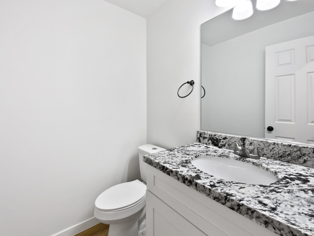 Half bath with toilet and vanity