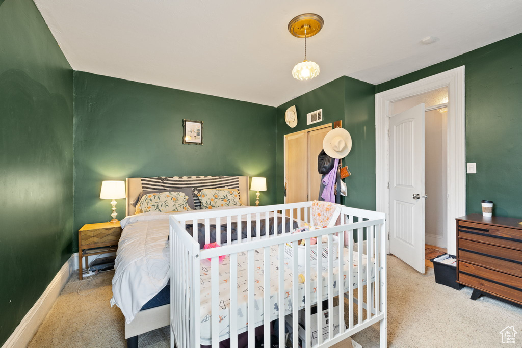 Carpeted bedroom with baseboards