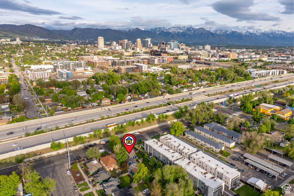 View of urban area with a mountain backdrop and a main thoroughfare
