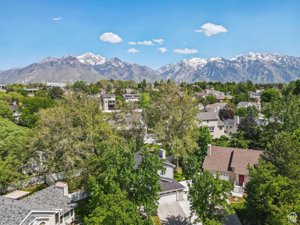 Aerial view of residential area with a mountainous background