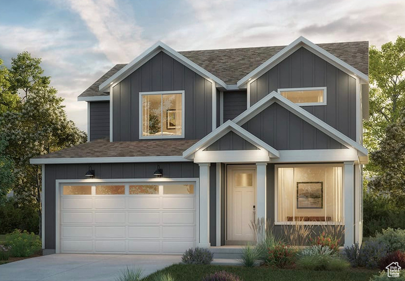View of front of property with a shingled roof, driveway, a garage, and board and batten siding