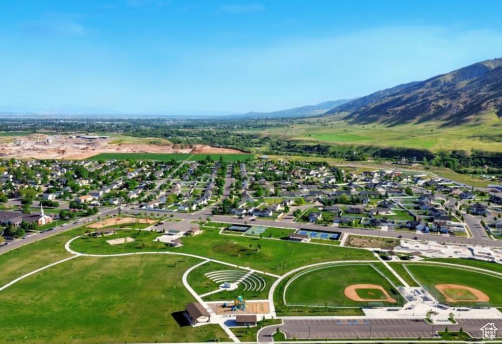 Aerial view of property\'s location with mountains and nearby suburban area