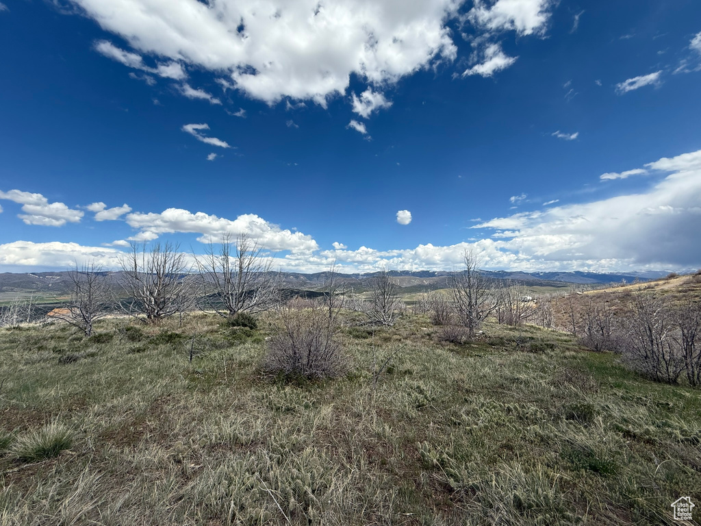 View of mountain background featuring rural landscape