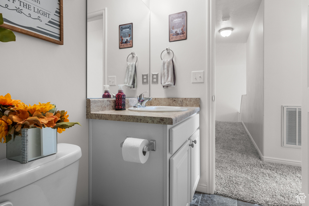 Bathroom with vanity and toilet