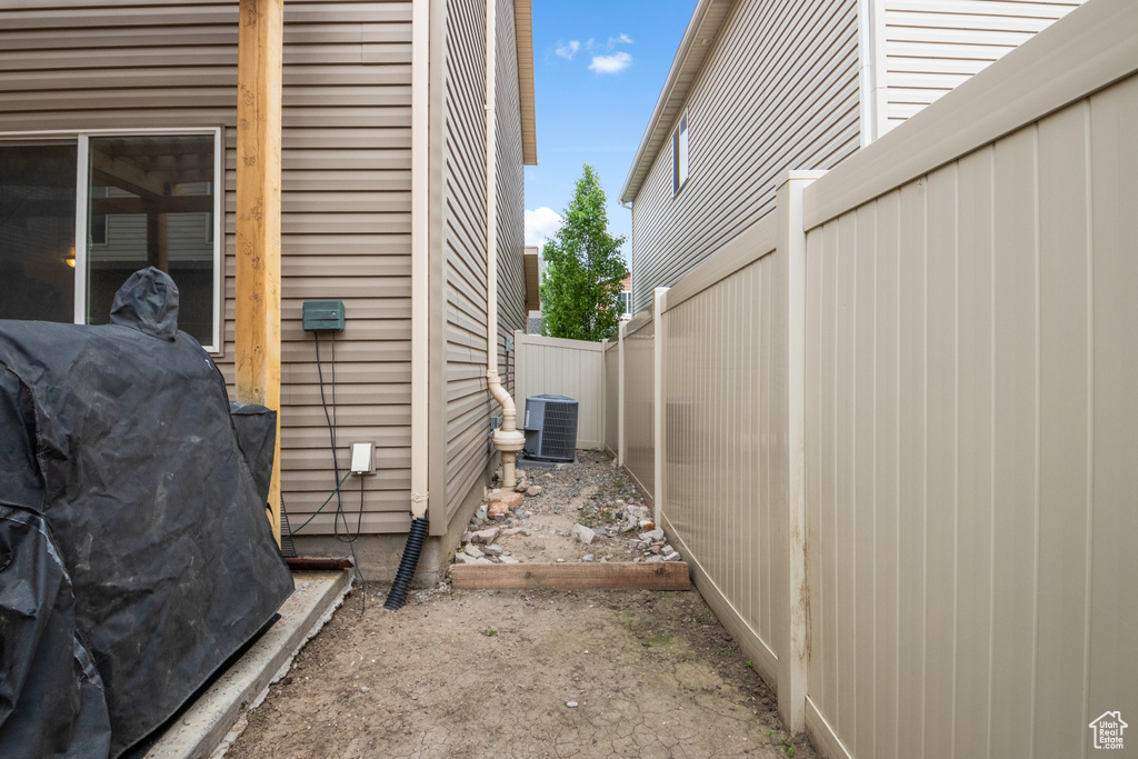 View of home\\\'s exterior with central AC and fence