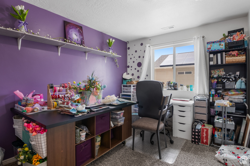Home office featuring carpet flooring