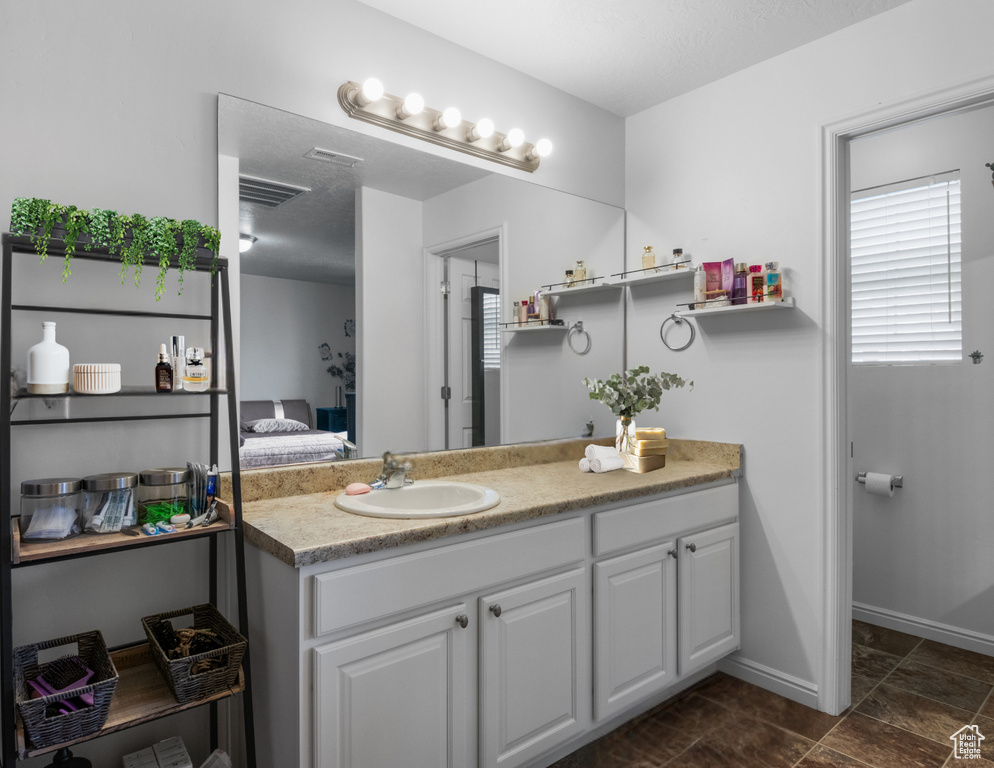 Ensuite bathroom featuring vanity