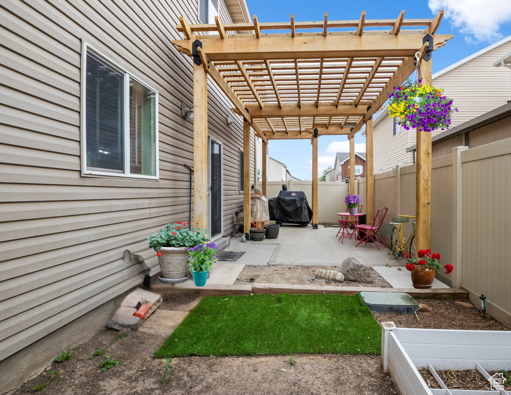 Fenced backyard featuring a patio area