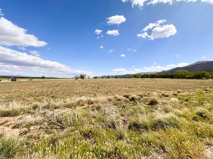 View of local wilderness featuring rural landscape and a mountainous background