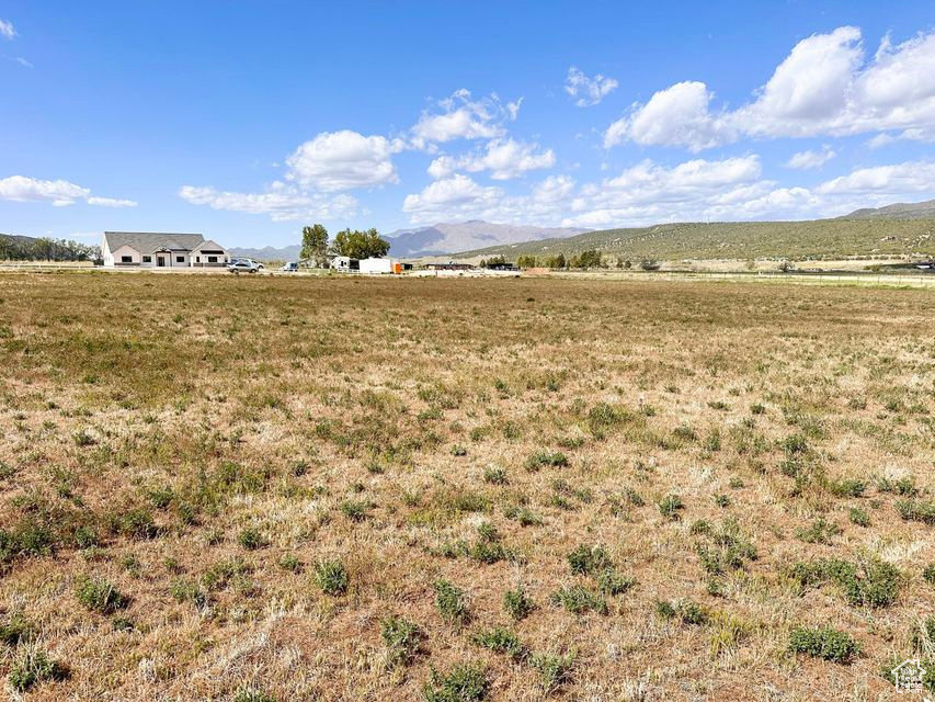 View of yard with a mountain view and a view of countryside