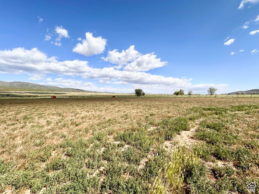 View of yard featuring a view of countryside and a mountain view
