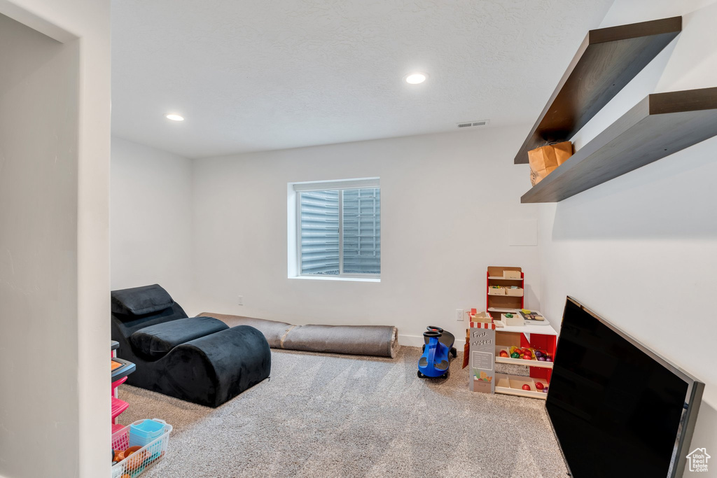 Recreation room featuring carpet floors, recessed lighting, and baseboards