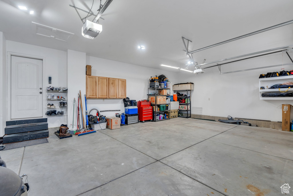 Garage featuring a garage door opener