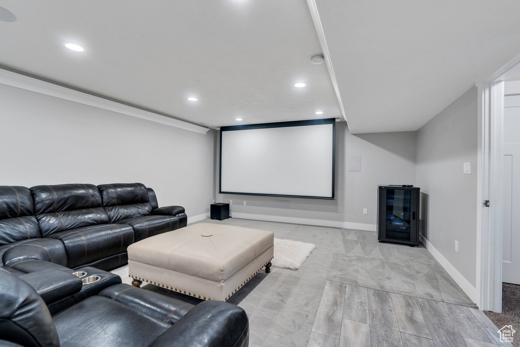 Cinema room featuring baseboards, recessed lighting, and crown molding
