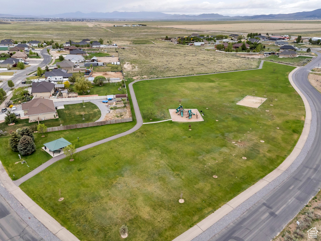 Aerial overview of property's location featuring nearby suburban area and mountains