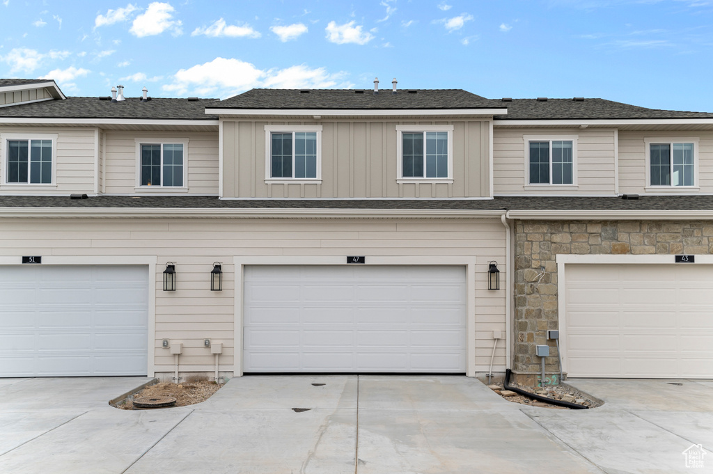 Garage with concrete driveway