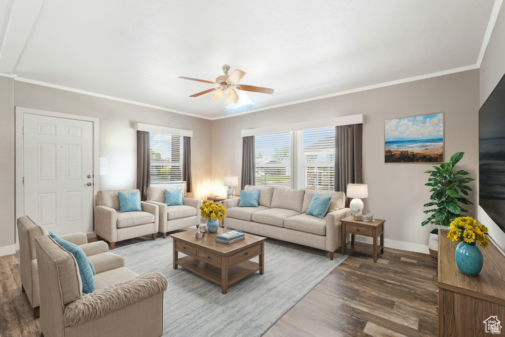 Living area with wood finished floors, baseboards, ceiling fan, and crown molding