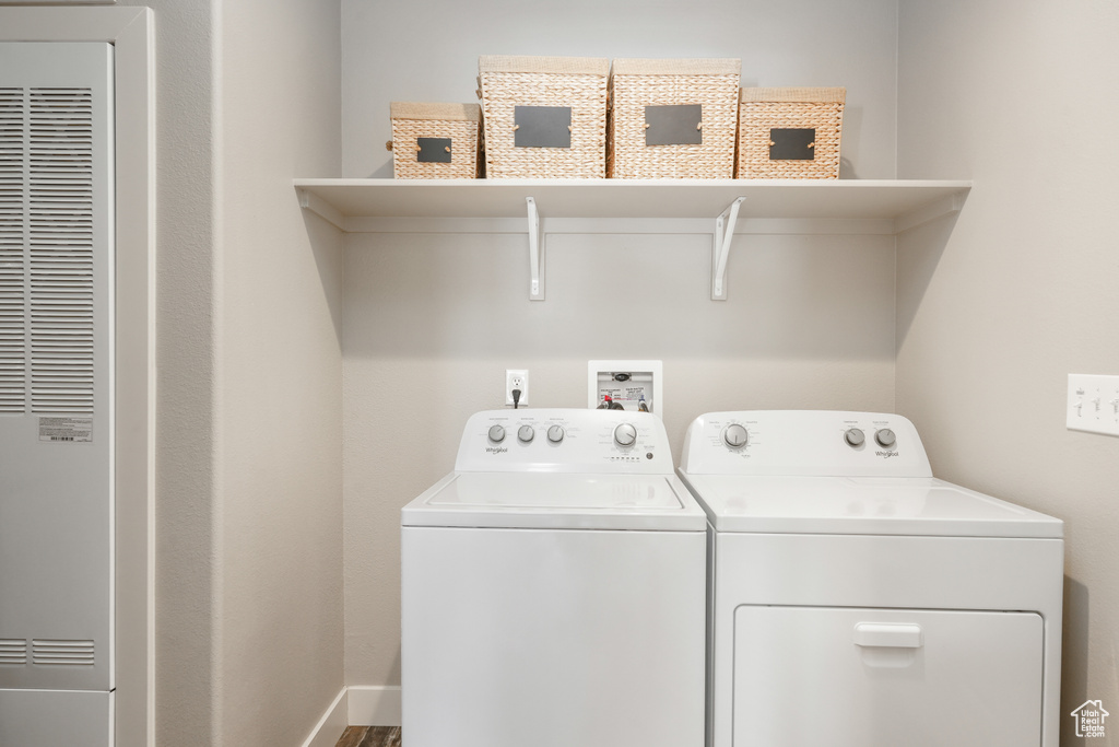 Clothes washing area with a heating unit and separate washer and dryer