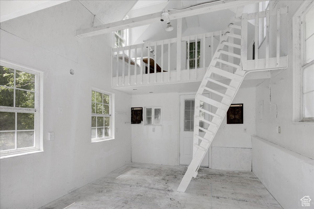 Staircase with a towering ceiling