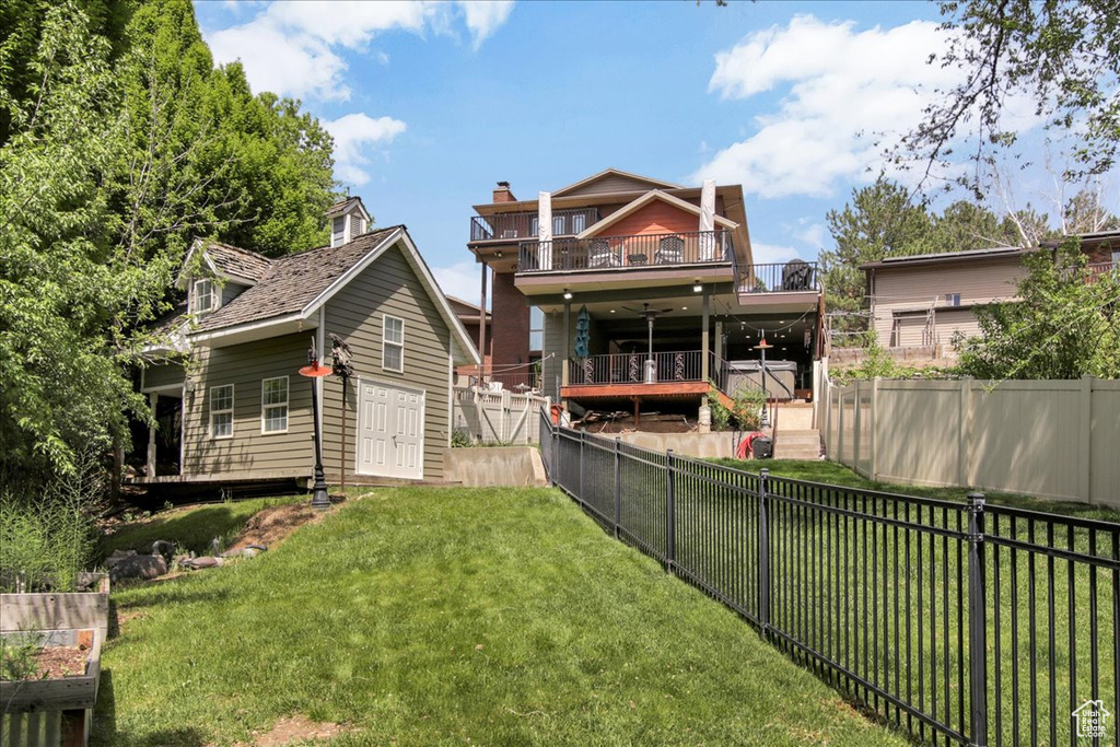 Back of house featuring a wooden deck