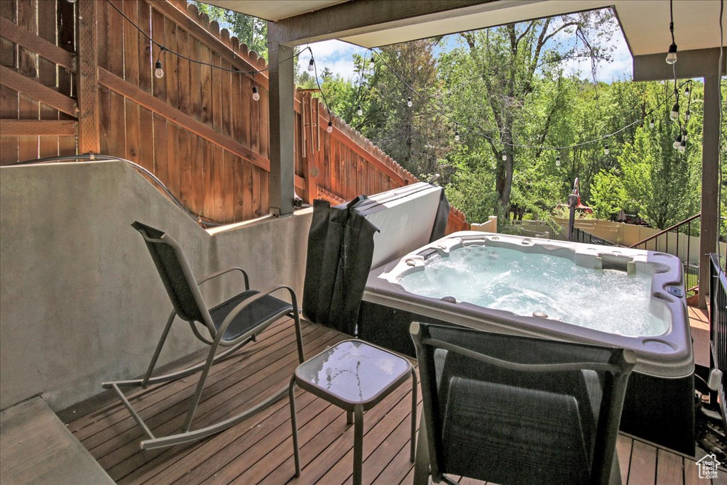 Wooden deck with a hot tub