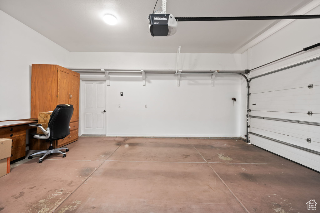 Garage featuring a garage door opener