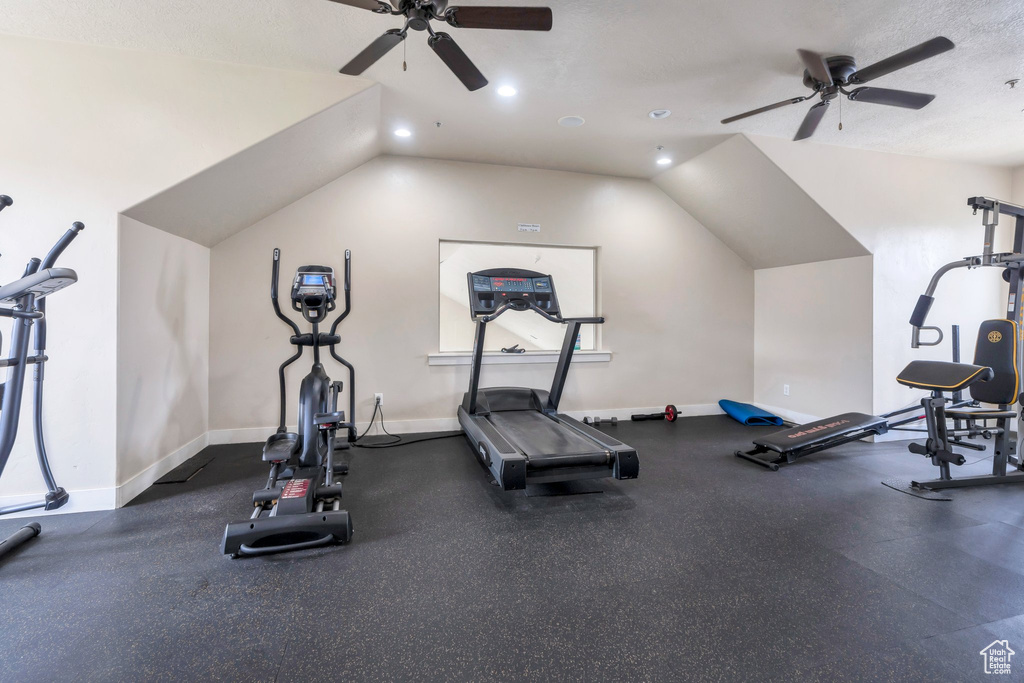 Exercise room with a ceiling fan, lofted ceiling, baseboards, and recessed lighting