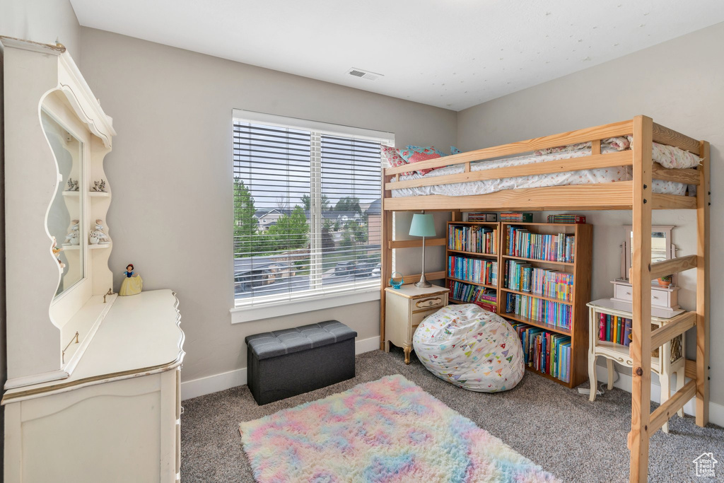 Bedroom with baseboards and carpet floors