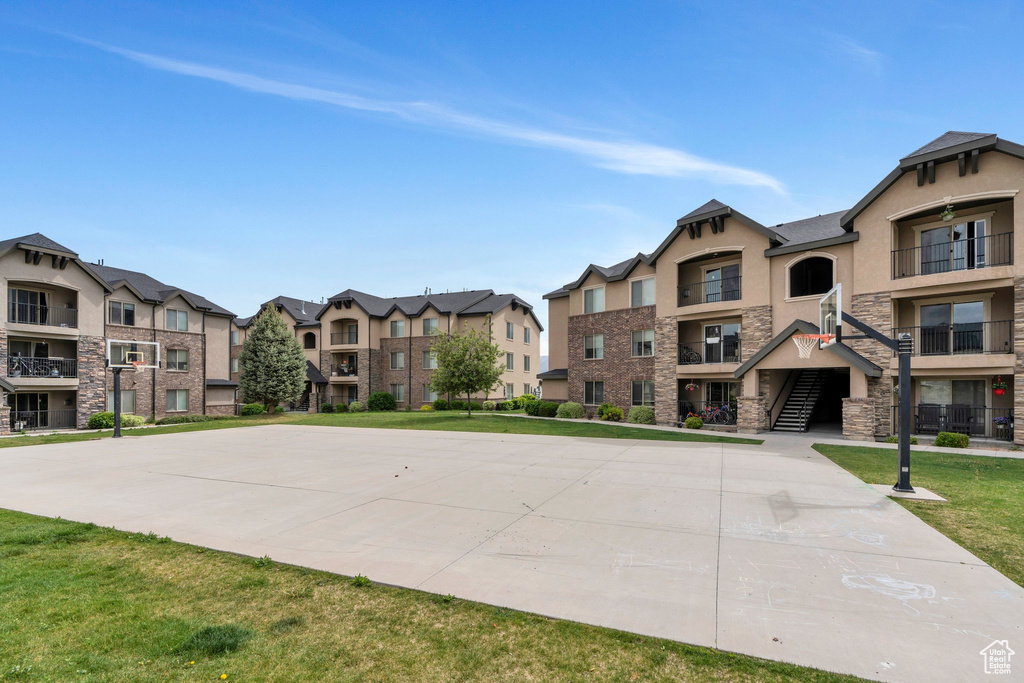 View of property\\\\\\\'s community featuring a residential view and a lawn