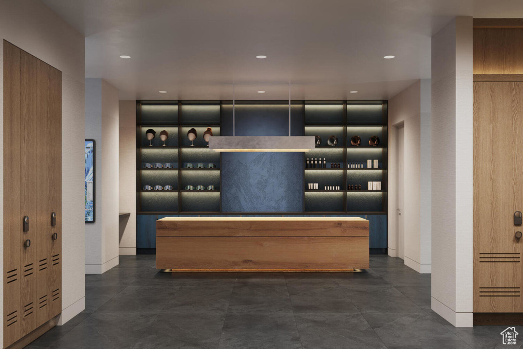 Wine room featuring baseboards and recessed lighting