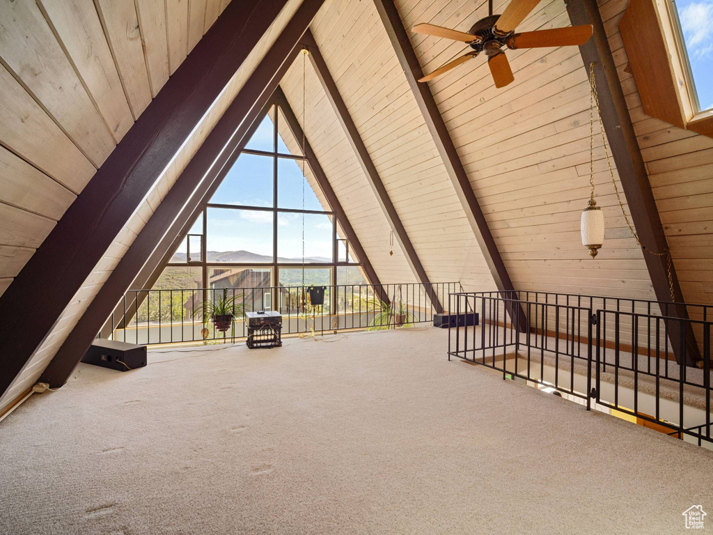 Additional living space with wooden ceiling, carpet flooring, and ceiling fan
