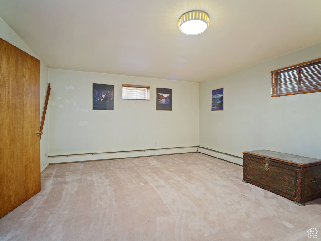 Basement with a baseboard radiator and baseboards