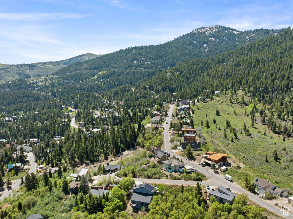Aerial overview of property\\\\\\\\\\\\\\\\\\\\\\\\\\\\\\\\\\\\\\\\\\\\\\\\\\\\\\\\\\\\\\\\\\\\\\\\\\\\\\\\\\\\\\\\\\\\\\\\\\\\\\\\\\\\\\\\\\\\\\\\\\\\\\\'s location featuring a forest and a mountain backdrop