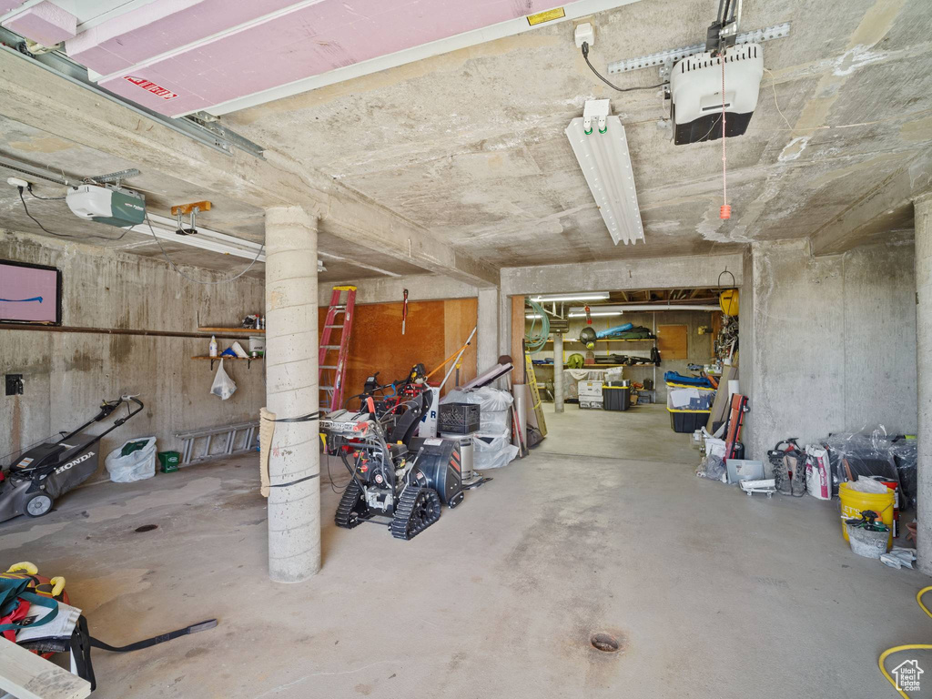 Garage featuring a garage door opener