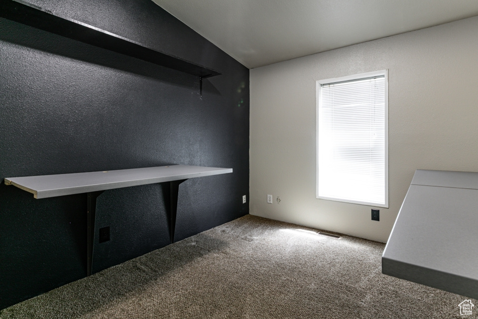 Empty room with carpet floors