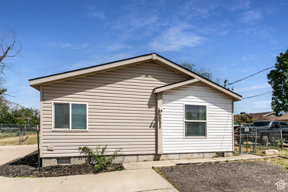 View of home's exterior featuring fence