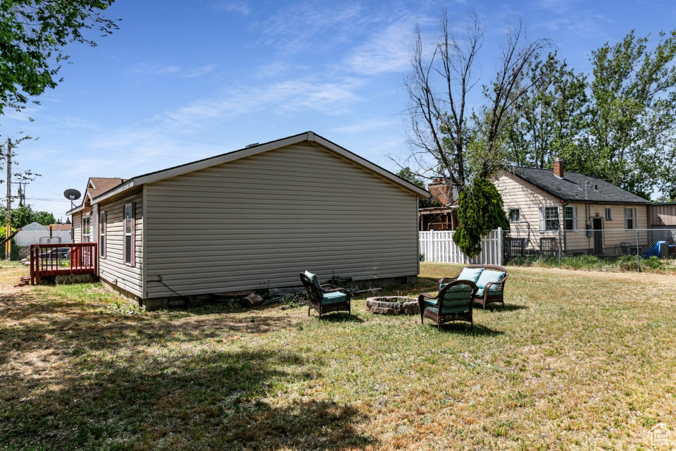 Back of property featuring a wooden deck